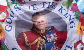  ?? ?? ‘In his oath, Charles must declare himself a faithful Protestant and swear to uphold the Church of England’s position as the establishe­d religion of England.’ A coronation flag on the Mall, central London, 3 May 2023. Photograph: Dan Kitwood/Getty Images