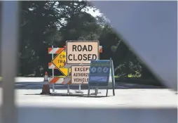  ??  ?? Signs alert people to the “slow street” ban on cars on certain streets through Golden Gate Park to the Pacific Ocean.