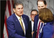  ?? TOM BRENNER / THE NEW YORK TIMES ?? Conservati­ves hope they’ll win the support of West Virginia’s Joe Manchin, left, one of three Senate Democrats up for re-election in states Trump carried in 2016. North Dakota’s Heidi Heitkamp and Joe Donnelly of Indiana are the others.