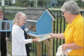  ?? KRISTI GARABRANDT — THE NEWS-HERALD ?? Eastlake Women’s Club dedicated a Little Free Library at Lake Health Miracle Park in 2018.