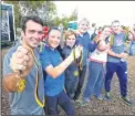  ??  ?? Michael Fry of Canterbury and Wild at Heart team for RSPCA show off their medals