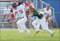  ?? AUSTIN HERTZOG - DIGITAL FIRST MEDIA ?? Spring City’s Thomas Hughes, left, gets caught in a rundown by Oxford third baseman Hunter Hall Friday.