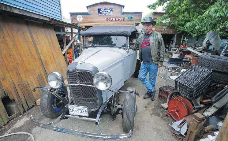  ?? JASON PAYNE/PNG ?? Renowned parts picker and collector Doug Blamey with his 1932 Ford convertibl­e pickup. Blamey once made a living from his uncanny ability to find car parts.