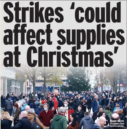  ?? ?? PANIC BUYS Shoppers face festive gloom