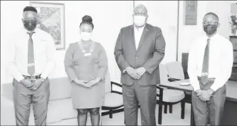  ??  ?? Prime Minister Mark Phillips with (from left) JCI Senator/Advisor Kevin Cornette, JCI Guyana President Kestine King, and JCI Vice President of Projects and Community Developmen­t Deshawn Walcott. (DPI photo)