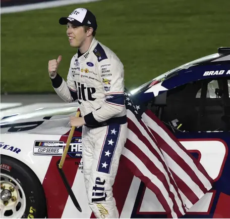  ?? GETTy IMAgES ?? WINNER’S CIRCLE: Brad Keselowski celebrates after winning the NASCAR Cup Series Coca-Cola 600 at Charlotte Motor Speedway early Monday morning in Concord, N.C.
