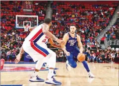  ?? CHRIS SCHWEGLER/NBAE/GETTY IMAGES/AFP ?? Ben Simmons of the Philadelph­ia 76ers drives to the basket in their game against the Detroit Pistons on Monday at Little Caesars Arena in Detroit, Michigan.