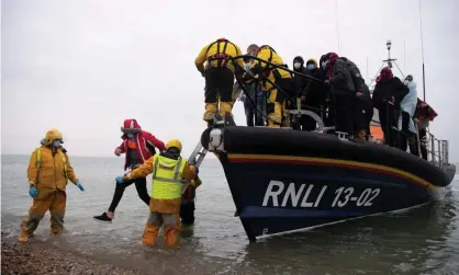  ?? Photograph: Ben Stansall/AFP/Getty Images ?? Migrants are helped ashore from a lifeboat at Dungeness in Kent. About two-thirds are fleeing conflict and persecutio­n in Iran, Iraq, Sudan and Syria.