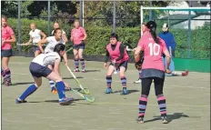  ?? 01_B38hockey0­2 ?? Catherine MacBain deflects the ball after an Ardrossan attempt at goal.