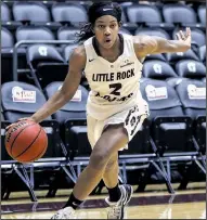  ?? Arkansas Democrat-Gazette/MITCHELL PE MASILUN ?? UALR’s Monique Townson drives to the basket against Louisiana-Monroe on Sunday at the Jack Stephens Center in Little Rock. The Trojans won 57-37.