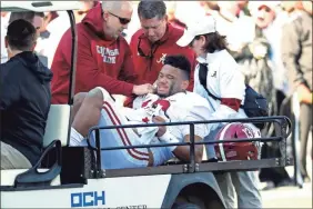  ?? AP-Rogelio V. Solis ?? Alabama quarterbac­k Tua Tagovailoa is carted off the field after getting injured in the first half.