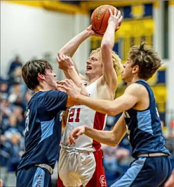  ?? For the Post-Gazette ?? Eden Christian’s Malachi Manges gets off a shot against tight Burgettsto­wn defense Tuesday night in a WPIAL Class 2A quarterfin­al game.