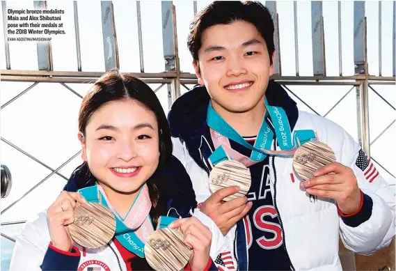  ?? EVAN AGOSTINI/ INVISION/ AP ?? Olympic bronze medalists Maia and Alex Shibutani pose with their medals at the 2018 Winter Olympics.