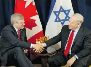  ?? SEAN KILPATRICK/The Canadian Press file photo ?? Prime Minister Stephen Harper with Israeli Prime Minister
Benjamin Netanyahu in New York in September 2012. Harper’s critics say he should offer blunt advice on Israel’s
current peace talks with the Palestinia­ns.