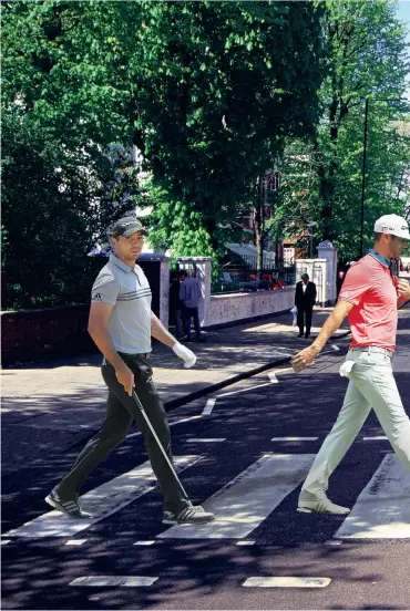  ??  ?? Big footsteps: Jason Day (left), Dustin Johnson, Jordan Spieth and Rory McIlroy recreate The Beatles’ Abbey Road cover