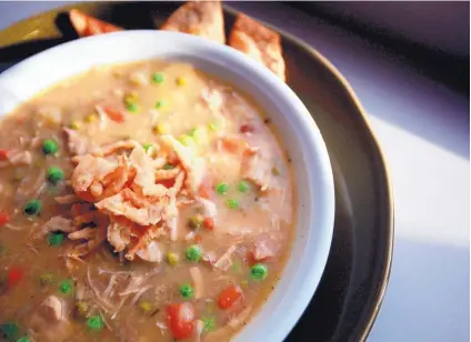  ?? REGINA H. BOONE/DETROIT FREE PRESS/TNS ?? Turkey Potpie Soup turns Thanksgivi­ng leftovers into a post-holiday meal.
