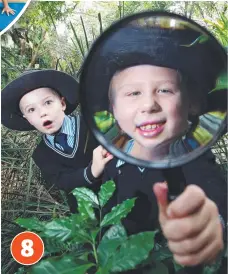  ?? Picture: RICHARD GOSLING ?? “Bush detectives” (from left) Brody Gray and Lilli Howard, both 7, inspect insects during a fun day at David Fleay Wildlife Park.