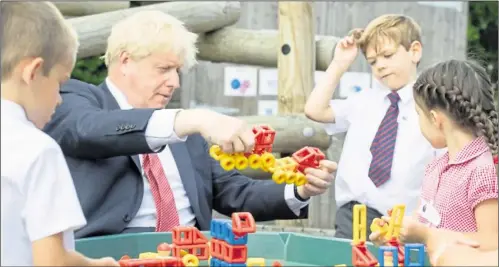  ?? Picture: PA ?? Boris Johnson takes control at The Discovery School in Kings Hill