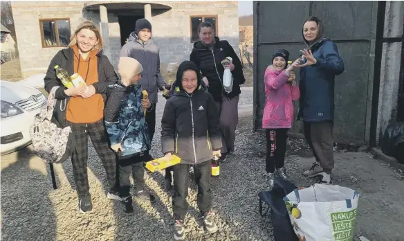  ?? ?? Families sharing a shelter in Ukraine