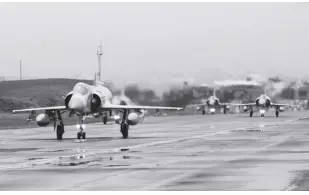  ?? AP/JOHNSON LAI ?? TAIWANESE Mirage 2000 fighter jets taxi along a runway during a drill at an airbase in Hsinchu, Taiwan on January 11, 2023. Taiwan scrambled fighter jets, put its navy on alert and activated missile systems on Tuesday, January 31, 2023, in response to nearby operations of 34 Chinese military aircraft and nine warships that are part Beijing’s strategy to unsettle and intimidate the self-governing island democracy.