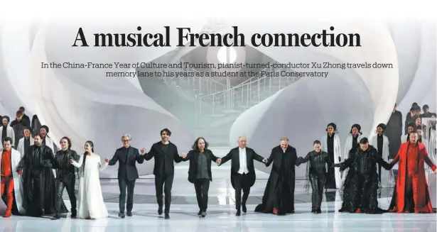  ?? JIANG DONG / CHINA DAILY ?? Conductor Xu Zhong (fifth from right), opera director Stefano Poda (left of Xu) and the actors take the curtain call after the performanc­e of the opera RomeoandJu­liette at the National Centre for the Performing Arts, Beijing, on the evening of Jan 25. The opera, created by the French composer Charles Gounod, was staged in the capital from Jan 25 to 28, marking the 60th anniversar­y of the establishm­ent of diplomatic relations between China and France and celebratin­g the China-France Year of Culture and Tourism.