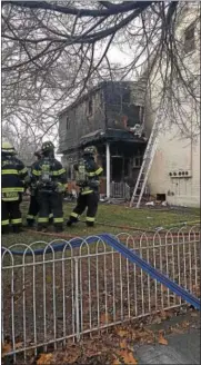  ?? MARIAN DENNIS — DIGITAL FIRST MEDIA ?? Fire crews help control a fire at 3rd and Johnson streets in Pottstown Wednesday morning.