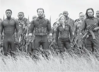  ??  ?? Chadwick Boseman, Chris Evans, Scarlet Johansson and Sebastian Stan in Avengers: Infinity War.