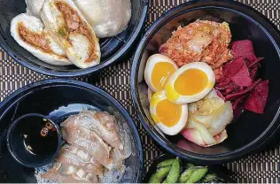  ??  ?? Taste what makes Kuriya @ Cherrity Bar special: Clockwise from top left are pork steamed buns, a pickle plate, charred edamame and gyoza dumplings.