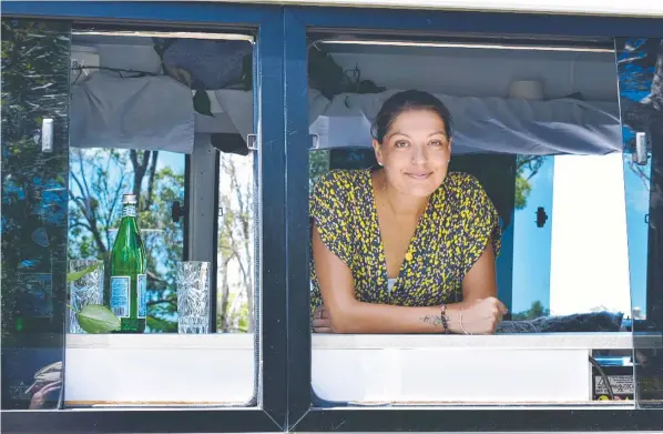  ?? Picture: Steve Cooke ?? Cairns mother Courtney Pitcher was diagnosed with breast cancer four years ago and is traveling down the east coast in a converted bus, ticking off experience­s as she goes.