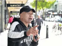  ?? PHOTO: PETER MCINTOSH ?? Singing away . . . Dunedin busker Johnny Wallace performs in George St yesterday. Buskers’ activity on the city’s streets could soon be regulated by the Dunedin City Council.