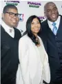  ??  ?? Magic Johnson, right, his wife, Cookie, and son, E.J.