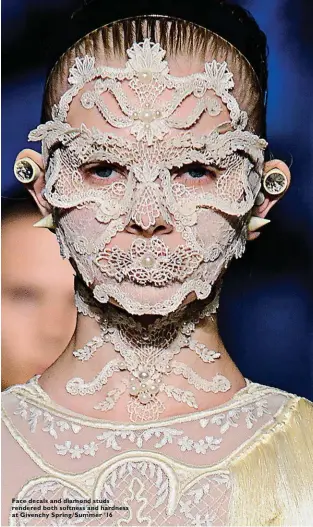  ??  ?? Face decals and diamond studs rendered both softness and hardness at Givenchy Spring/ Summer ’16