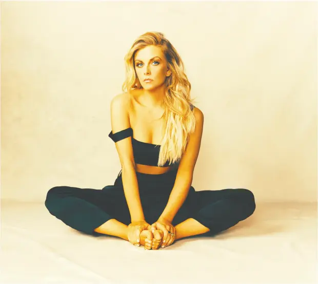  ?? Jeremy Cowart ?? Country singer Lindsay Ell shares her experience­s as a rape victim in Make You, a sombre but empowering song on her new album, Heart Theory.