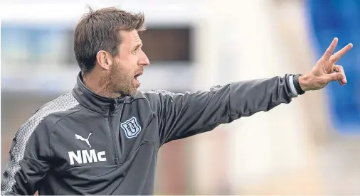  ??  ?? UNDER PRESSURE: Dundee manager Neil McCann needs wins to lift his club away from the danger area at the foot of the Premiershi­p