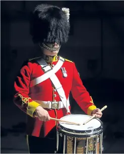  ?? Pictures: Kris Miller and Getty Images. ?? Clockwise from right: Trooper David Hall practices on drums; a tattoo dress rehearsal; soldiers learn their music; pipers in front of Edinburgh Castle; Sergeant Alan Mowbray with the regiment’s Brit and a detail of its uniform.