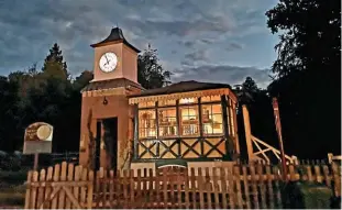  ?? ?? Lighting-up time: The former Liphook station signalbox, at its home beside the Hollycombe Steam Collection clock tower, lights up a dark sky. Opened by the LSWR, believed to be in 1877, and closed by BR 98 years later, the ’box is currently in the final stages of a major restoratio­n that has been matchedfun­ded by the son of a signalman who worked in the ’box in the early 1950s.
HOLLYCOMBE STEAM COLLECTION ARCHIVE
