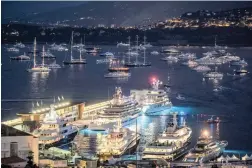  ?? PICTURE: BLOOMBERG ?? BRIGHT LIGHTS: Iiluminate­d vessels in Port Hercules, Monaco.