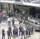  ?? Ian Maule Tulsa World photo
via AP ?? Emergency personnel respond to a
shooting at the Natalie Medical Building Wednesday in Tulsa, Okla. Multiple people were shot at the hospital campus.