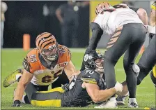  ?? [FRED VUICH/THE ASSOCIATED PRESS] ?? T.J. Watt gets one of the four sacks the Steelers recorded against Andy Dalton.