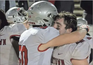  ?? Jeremy Stewart ?? Cedartown junior linebacker Eli Barrow (right) is hugged by teammate Zak Tillery after the Bulldogs’ loss to Carver-Columbus in the Class 4A state semifinals in Columbus on Friday, ending their season.
