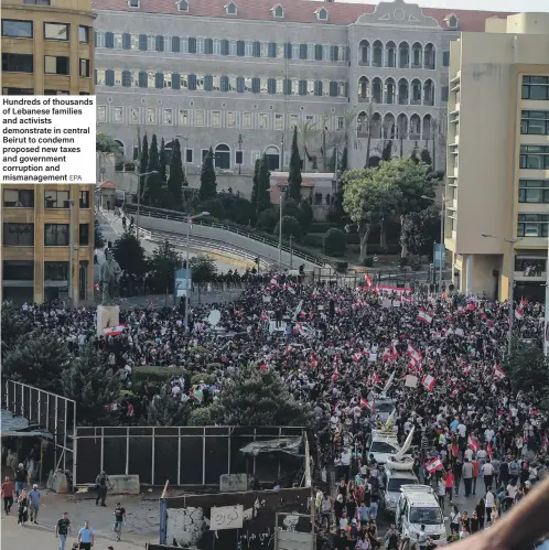  ??  ?? Hundreds of thousands of Lebanese families and activists demonstrat­e in central Beirut to condemn proposed new taxes and government corruption and mismanagem­ent