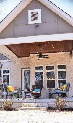  ??  ?? Rik Sowell said his late wife, Lynne, wanted to enclose the back porch and add a fireplace. A patio was created with antique bricks Sowell rescued from a historic-home demolition.