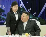  ?? KOREAN CENTRAL NEWS AGENCY/KOREA NEWS SERVICE VIA AP ?? In this photo provided by the North Korean government, North Korean leader Kim Jong Un and his daughter attend a feast to mark the 75th founding anniversar­y of the Korean People’s Army at an unspecifie­d place in North Korea Tuesday, Feb. 7, 2023. Independen­t journalist­s were not given access to cover the event depicted in this image distribute­d by the North Korean government. The content of this image is as provided and cannot be independen­tly verified. Korean language watermark on image as provided by source reads: “KCNA” which is the abbreviati­on for Korean Central News Agency.