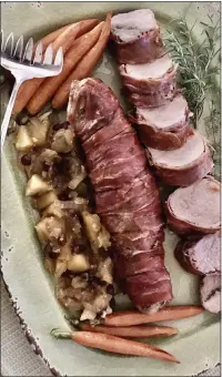  ?? PHOTOS BY CATHY THOMAS ?? Pork Tenderloin­s With Prosciutto and Apple Chutney is a meat lover’s treat.