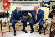  ?? [AP PHOTO] ?? President Donald Trump talks with new White House Chief of Staff John Kelly after he was privately sworn in during a ceremony Monday.