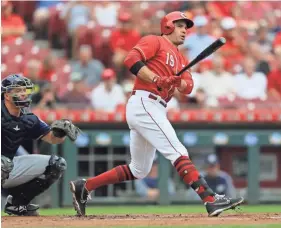  ??  ?? Reds first baseman Joey Votto bats against the Brewers during a game last season. AARON DOSTER/USA TODAY SPORTS