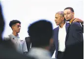  ?? Yalonda M. James / The Chronicle ?? Former President Barack Obama embraces Warriors guard Stephen Curry after their town hall conversati­on in Oakland about mentoring boys.