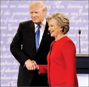  ?? AP/PATRICK SEMANSKY ?? Republican Donald Trump shakes hands with Democrat Hillary Clinton on Monday during the presidenti­al debate at Hofstra University in Hempstead, N.Y.
