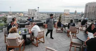  ?? Paul Stephen / Staff ?? The Moon’s Daughters in the new Thompson San Antonio hotel towers 20 floors above the city.