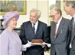 ??  ?? Currant affairs: the Queen gave the TMS team a cake